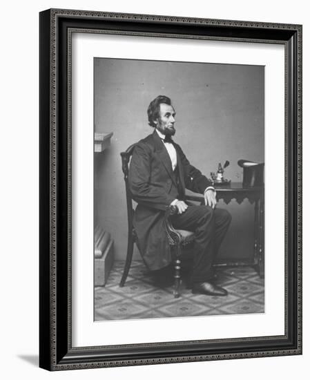 Abraham Lincoln, full-length portrait, seated, 1861-Alexander Gardner-Framed Photographic Print