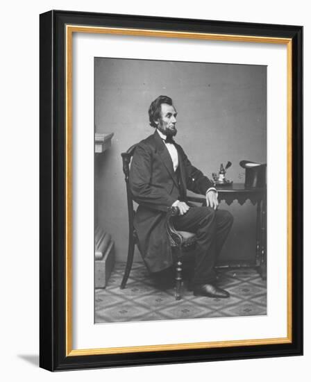 Abraham Lincoln, full-length portrait, seated, 1861-Alexander Gardner-Framed Photographic Print