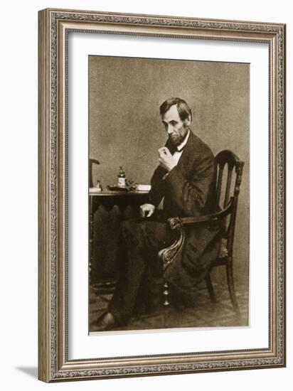 Abraham Lincoln Sitting at Desk, 1861-Mathew Brady-Framed Giclee Print