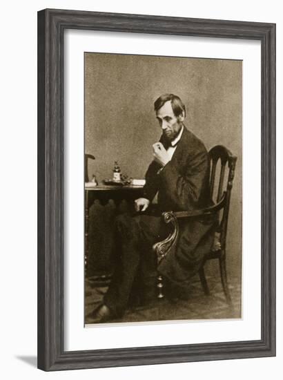 Abraham Lincoln Sitting at Desk, 1861-Mathew Brady-Framed Giclee Print