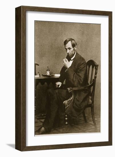 Abraham Lincoln Sitting at Desk, 1861-Mathew Brady-Framed Giclee Print