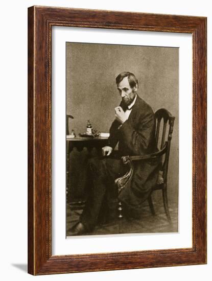 Abraham Lincoln Sitting at Desk, 1861-Mathew Brady-Framed Giclee Print