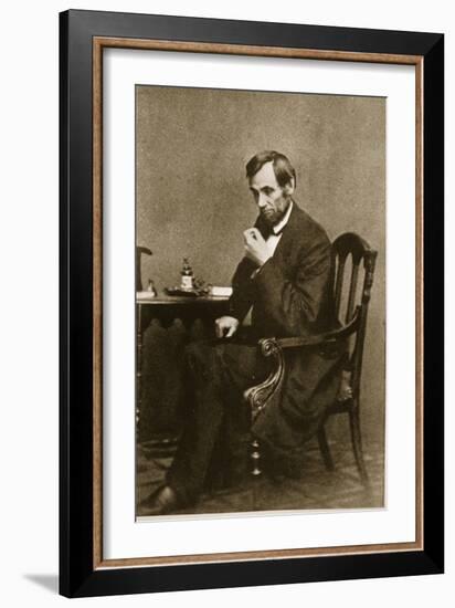 Abraham Lincoln Sitting at Desk, 1861-Mathew Brady-Framed Giclee Print