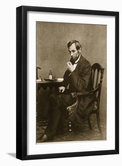 Abraham Lincoln Sitting at Desk, 1861-Mathew Brady-Framed Giclee Print