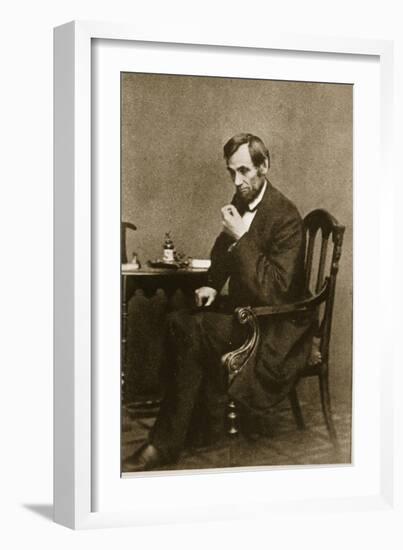 Abraham Lincoln Sitting at Desk, 1861-Mathew Brady-Framed Giclee Print