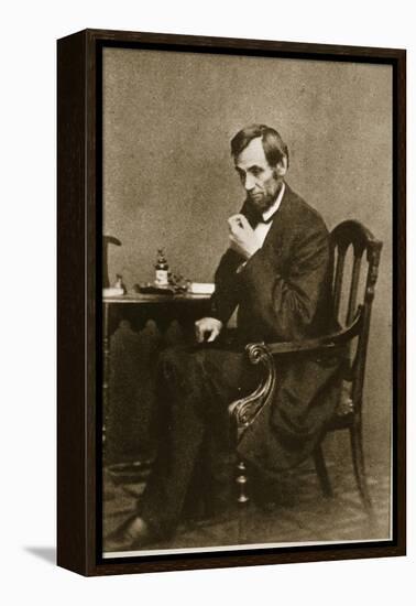 Abraham Lincoln Sitting at Desk, 1861-Mathew Brady-Framed Premier Image Canvas