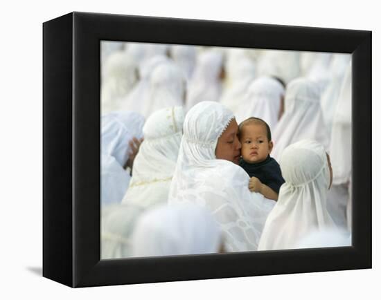 Acehnese Woman Holds a Child after Eid Al-Adha Prayer in the Tsunami-Ravaged Town of Meulaboh-null-Framed Premier Image Canvas