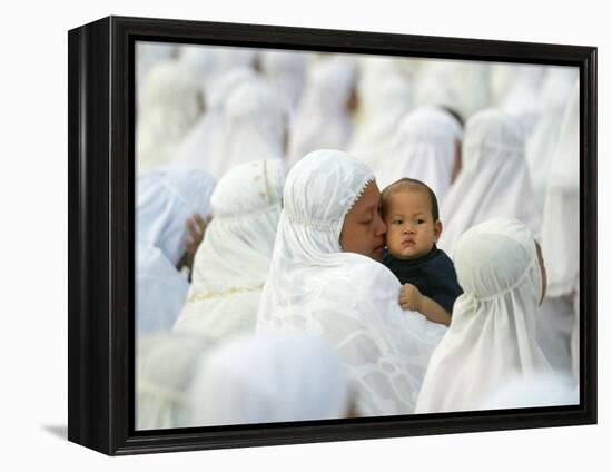 Acehnese Woman Holds a Child after Eid Al-Adha Prayer in the Tsunami-Ravaged Town of Meulaboh-null-Framed Premier Image Canvas