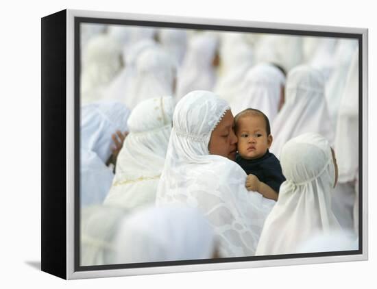 Acehnese Woman Holds a Child after Eid Al-Adha Prayer in the Tsunami-Ravaged Town of Meulaboh-null-Framed Premier Image Canvas