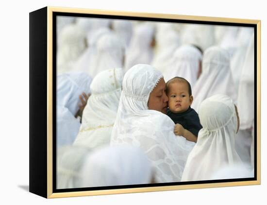 Acehnese Woman Holds a Child after Eid Al-Adha Prayer in the Tsunami-Ravaged Town of Meulaboh-null-Framed Premier Image Canvas