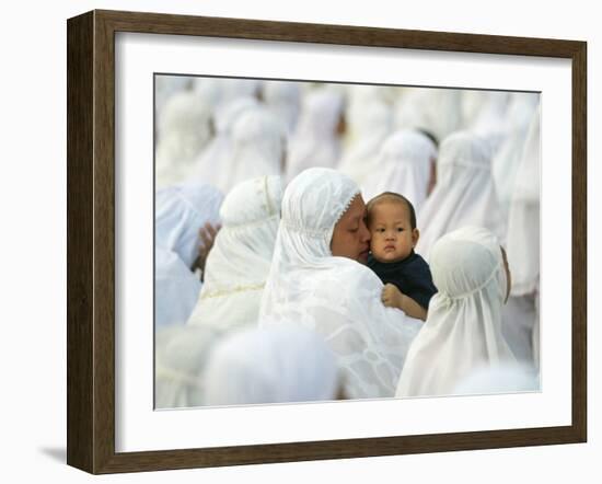 Acehnese Woman Holds a Child after Eid Al-Adha Prayer in the Tsunami-Ravaged Town of Meulaboh-null-Framed Photographic Print