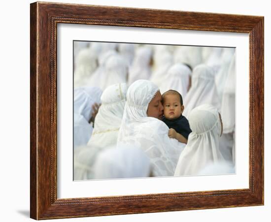 Acehnese Woman Holds a Child after Eid Al-Adha Prayer in the Tsunami-Ravaged Town of Meulaboh-null-Framed Photographic Print