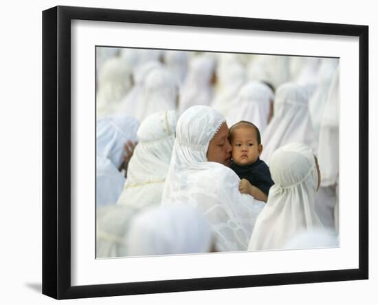 Acehnese Woman Holds a Child after Eid Al-Adha Prayer in the Tsunami-Ravaged Town of Meulaboh-null-Framed Photographic Print