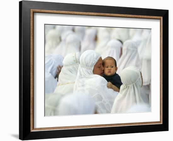 Acehnese Woman Holds a Child after Eid Al-Adha Prayer in the Tsunami-Ravaged Town of Meulaboh-null-Framed Photographic Print