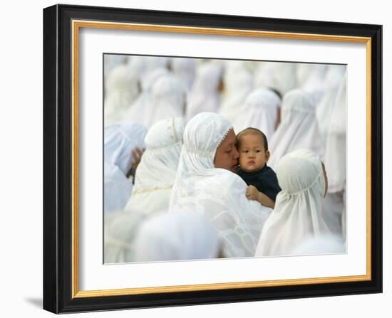 Acehnese Woman Holds a Child after Eid Al-Adha Prayer in the Tsunami-Ravaged Town of Meulaboh-null-Framed Photographic Print