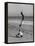 Acrobat/Actor, Russ Tamblyn Doing a Flip on Beach with Movie Actress Venetia Stevenson Watching Him-Allan Grant-Framed Premier Image Canvas