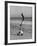 Acrobat/Actor, Russ Tamblyn Doing a Flip on Beach with Movie Actress Venetia Stevenson Watching Him-Allan Grant-Framed Premium Photographic Print