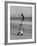 Acrobat/Actor, Russ Tamblyn Doing a Flip on Beach with Movie Actress Venetia Stevenson Watching Him-Allan Grant-Framed Premium Photographic Print