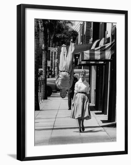 Acrobat and Actor, Russ Tamblyn Doing a Flip on the Sidewalk with Starlet Venetia Stevenson-Allan Grant-Framed Premium Photographic Print