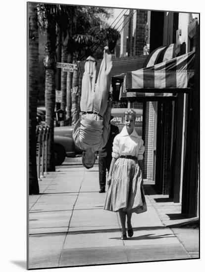 Acrobat and Actor, Russ Tamblyn Doing a Flip on the Sidewalk with Starlet Venetia Stevenson-Allan Grant-Mounted Premium Photographic Print