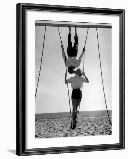 Acrobat and Actor, Russ Tamblyn on the Beach with Movie Actress Venetia Stevenson-Allan Grant-Framed Premium Photographic Print