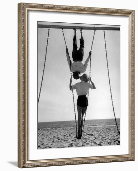 Acrobat and Actor, Russ Tamblyn on the Beach with Movie Actress Venetia Stevenson-Allan Grant-Framed Premium Photographic Print