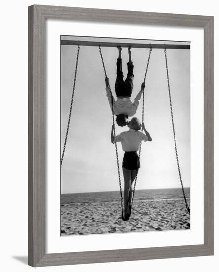 Acrobat and Actor, Russ Tamblyn on the Beach with Movie Actress Venetia Stevenson-Allan Grant-Framed Premium Photographic Print