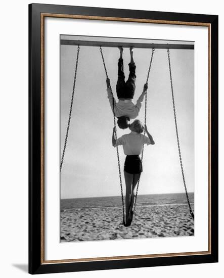Acrobat and Actor, Russ Tamblyn on the Beach with Movie Actress Venetia Stevenson-Allan Grant-Framed Premium Photographic Print