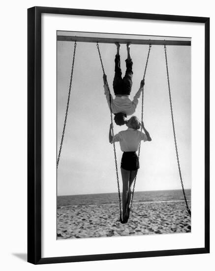 Acrobat and Actor, Russ Tamblyn on the Beach with Movie Actress Venetia Stevenson-Allan Grant-Framed Premium Photographic Print