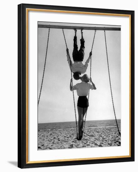 Acrobat and Actor, Russ Tamblyn on the Beach with Movie Actress Venetia Stevenson-Allan Grant-Framed Premium Photographic Print