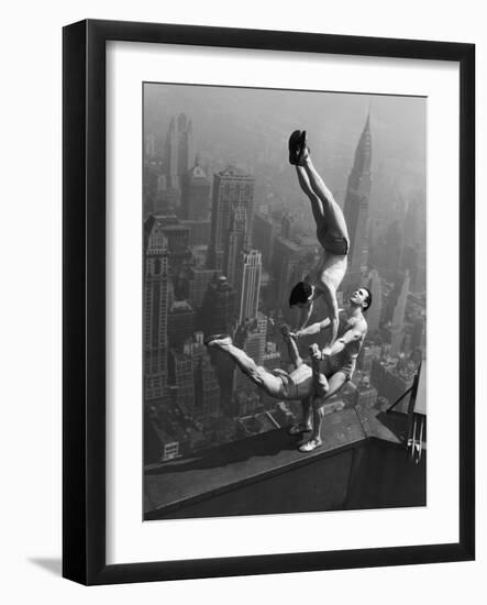 Acrobats Performing on the Empire State Building-null-Framed Photographic Print