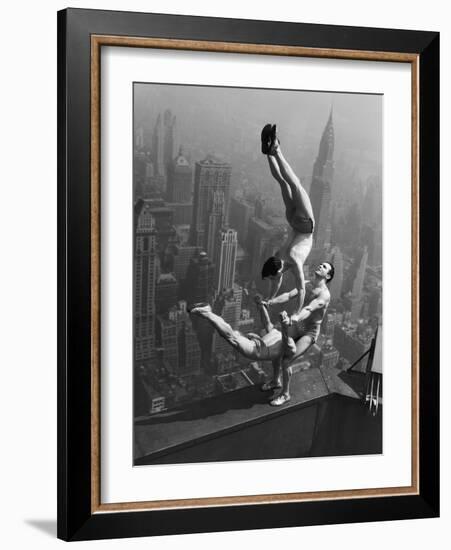 Acrobats Performing on the Empire State Building-null-Framed Photographic Print