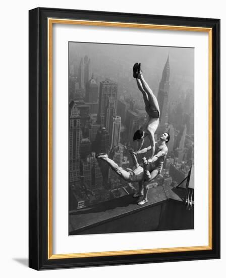 Acrobats Performing on the Empire State Building-null-Framed Photographic Print