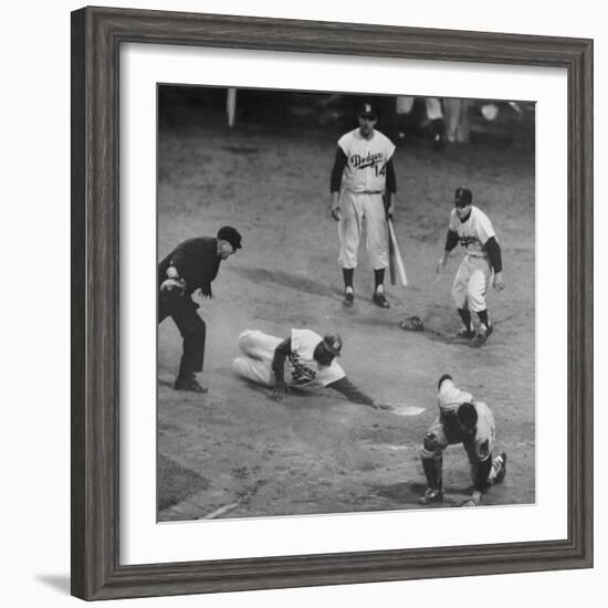 Action During a Game Between the Brooklyn Dodgers and the Milwaukee Braves at Ebbet's Field-Ralph Morse-Framed Premium Photographic Print