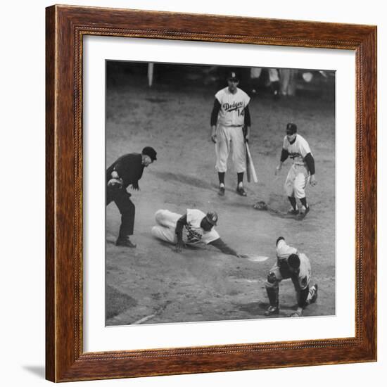 Action During a Game Between the Brooklyn Dodgers and the Milwaukee Braves at Ebbet's Field-Ralph Morse-Framed Premium Photographic Print