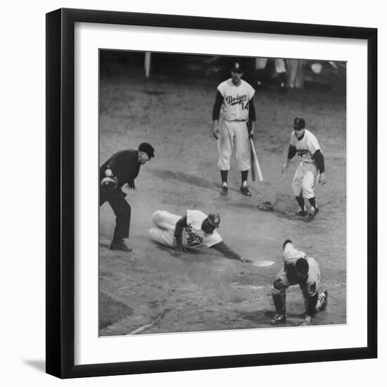 Action During a Game Between the Brooklyn Dodgers and the Milwaukee Braves at Ebbet's Field-Ralph Morse-Framed Premium Photographic Print