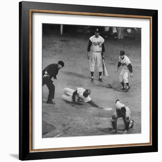 Action During a Game Between the Brooklyn Dodgers and the Milwaukee Braves at Ebbet's Field-Ralph Morse-Framed Premium Photographic Print