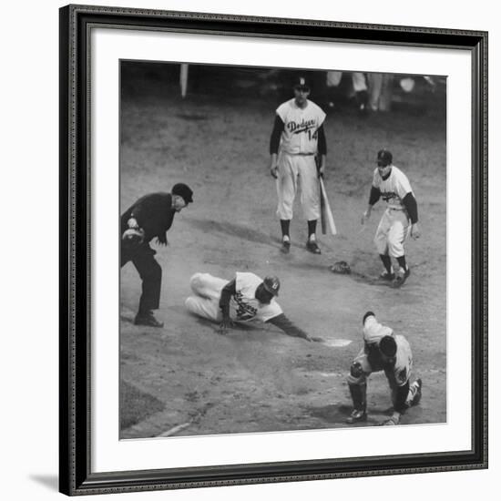 Action During a Game Between the Brooklyn Dodgers and the Milwaukee Braves at Ebbet's Field-Ralph Morse-Framed Premium Photographic Print