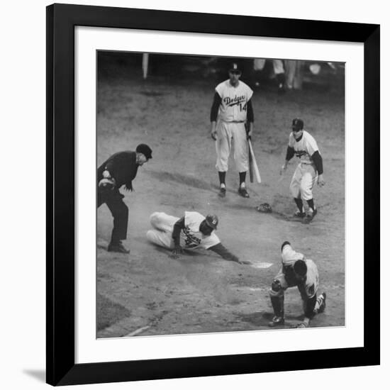 Action During a Game Between the Brooklyn Dodgers and the Milwaukee Braves at Ebbet's Field-Ralph Morse-Framed Premium Photographic Print