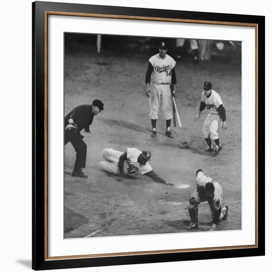 Action During a Game Between the Brooklyn Dodgers and the Milwaukee Braves at Ebbet's Field-Ralph Morse-Framed Premium Photographic Print