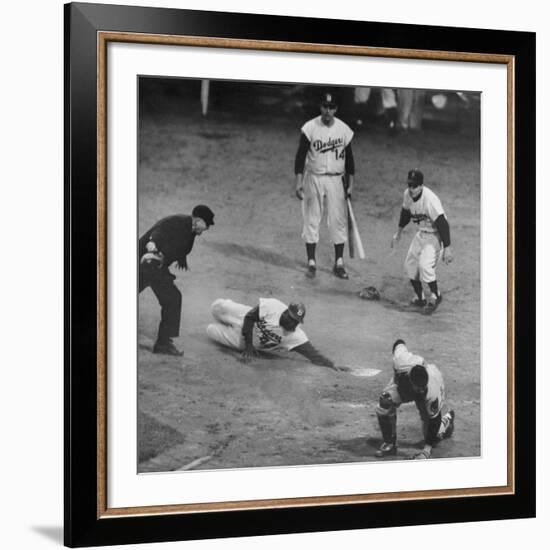 Action During a Game Between the Brooklyn Dodgers and the Milwaukee Braves at Ebbet's Field-Ralph Morse-Framed Premium Photographic Print