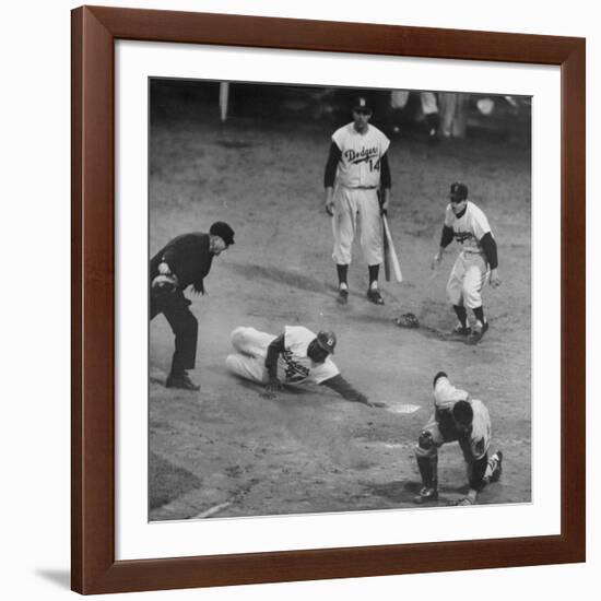 Action During a Game Between the Brooklyn Dodgers and the Milwaukee Braves at Ebbet's Field-Ralph Morse-Framed Premium Photographic Print