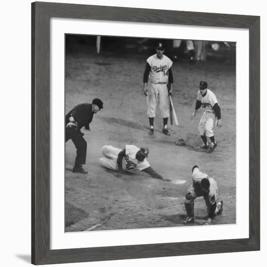 Action During a Game Between the Brooklyn Dodgers and the Milwaukee Braves at Ebbet's Field-Ralph Morse-Framed Premium Photographic Print