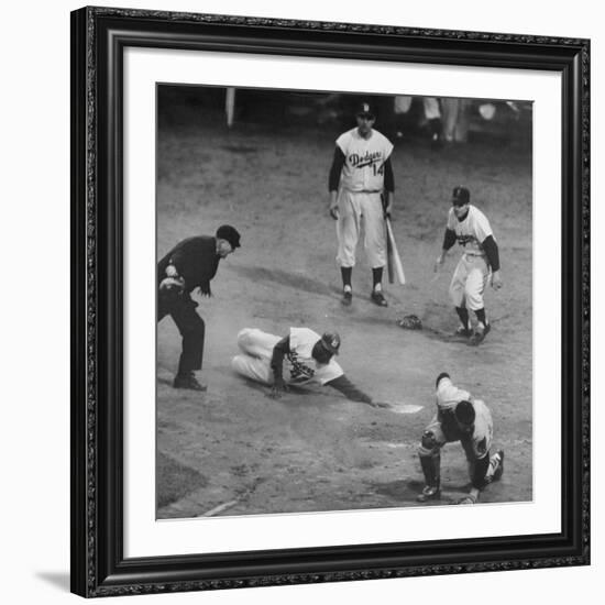 Action During a Game Between the Brooklyn Dodgers and the Milwaukee Braves at Ebbet's Field-Ralph Morse-Framed Premium Photographic Print