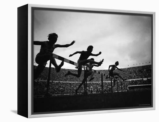 Action During the Women's 100m Hurdles at the 1952 Olympic Games in Helsinki-Mark Kauffman-Framed Premier Image Canvas