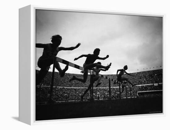 Action During the Women's 100m Hurdles at the 1952 Olympic Games in Helsinki-Mark Kauffman-Framed Premier Image Canvas