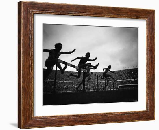 Action During the Women's 100m Hurdles at the 1952 Olympic Games in Helsinki-Mark Kauffman-Framed Photographic Print