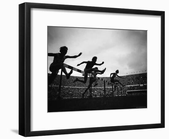 Action During the Women's 100m Hurdles at the 1952 Olympic Games in Helsinki-Mark Kauffman-Framed Photographic Print