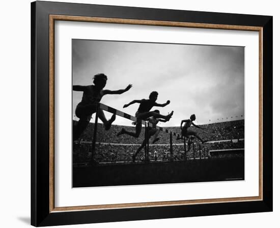 Action During the Women's 100m Hurdles at the 1952 Olympic Games in Helsinki-Mark Kauffman-Framed Photographic Print