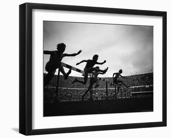 Action During the Women's 100m Hurdles at the 1952 Olympic Games in Helsinki-Mark Kauffman-Framed Photographic Print